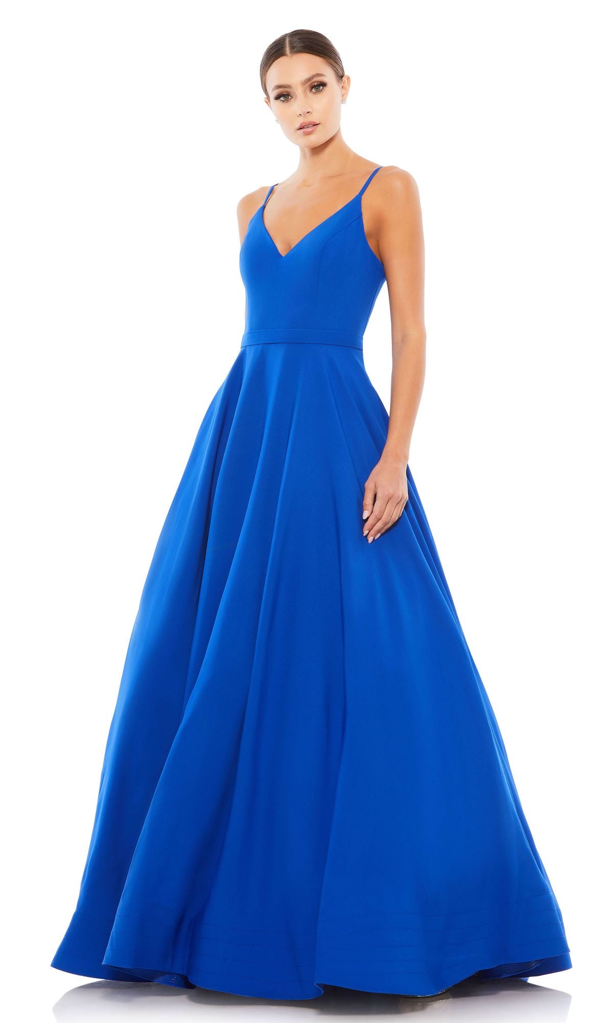 A woman models the Classic Long A-Line Formal Dress (Mac Duggal 48855), a sleeveless, floor-length royal blue gown with a fitted bodice and flared skirt, set against a white background.